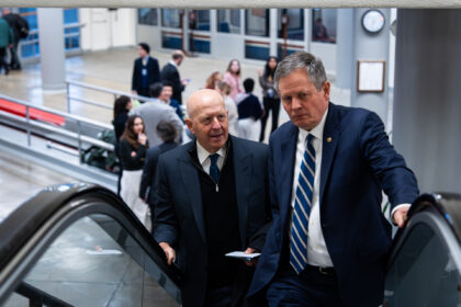 David Solomon, chief executive officer of Goldman Sachs Group Inc., left, and Senator Stev