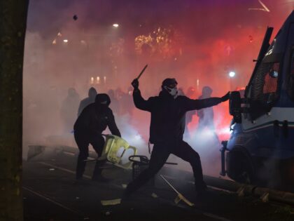 TURIN, ITALY - 2026/01/31: Protesters attack an armored police vehicle during the national