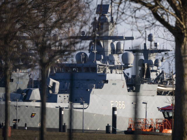 03 February 2026, Hamburg: The corvette "Emden" is in the harbor. Two men have b