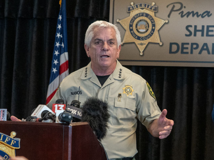 CATALINA, ARIZONA - FEBRUARY 3: Pima County Sheriff, Chris Nanos (left), speaks to the med