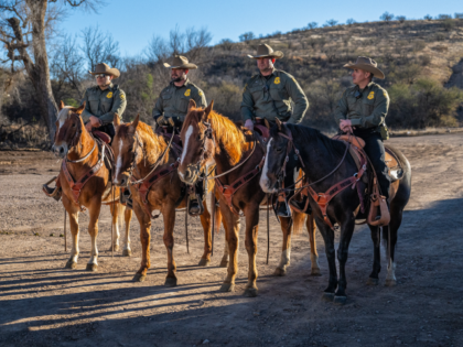 Law enforcement officers on horseback ahead of a news conference with Kristi Noem, secreta