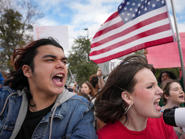 PFLUGERVILLE, TX - FEBRUARY 2: Aeden, left, and Kat Pruett-Ponvert, 17, protest U.S. Immig