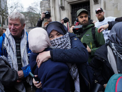 Defiant and jubilant supporters of Palestine Action and members of Defend our Juries celeb