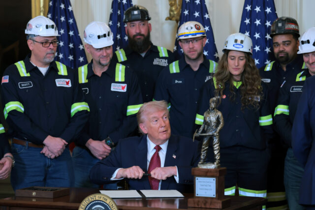 WASHINGTON, DC - FEBRUARY 11: U.S. President Donald Trump hands out pens after signing an