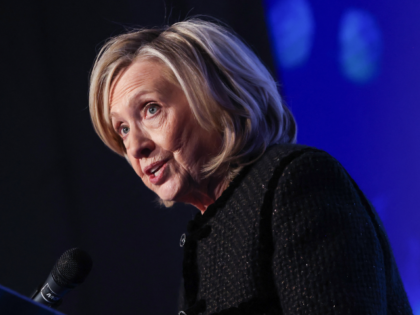 Former US Secretary of State Hillary Clinton speaks on stage as she attends the The World