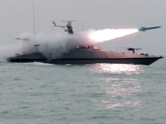 headline: Iran Fires Live Missiles in Strait of Hormuz as Ta