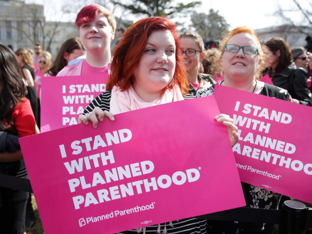 WASHINGTON, DC - MARCH 01: Activists participate in a rally to support Planned Parenthood