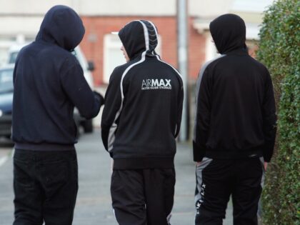 BRISTOL, UNITED KINGDOM - FEBRUARY 2: Young people in hooded tops gather on street in Know