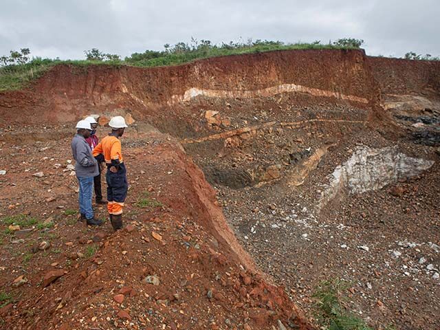 Workers inspect an open cast at Arcadia Lithium mine on January 11, 2022 in Goromonzi, Zim