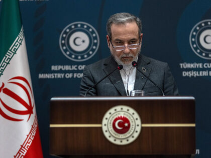 Iranian Foreign Minister Abbas Araghchi gives a statement at the Ritz Hotel as he meets Tu
