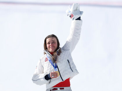 Gold medalist Breezy Johnson of Team United States celebrates on the podium during the med
