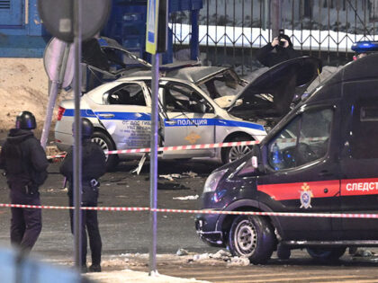 Security forces conduct investigation at the scene after an explosion near traffic police