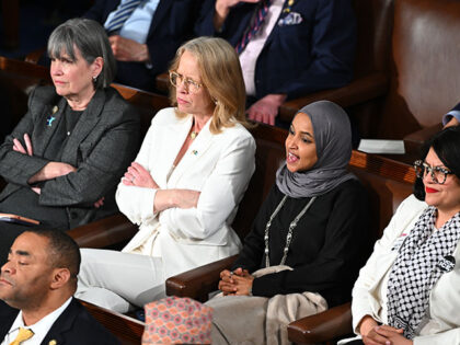 Representative Ilhan Omar, a Democrat from Minnesota, second right, yells during a State o