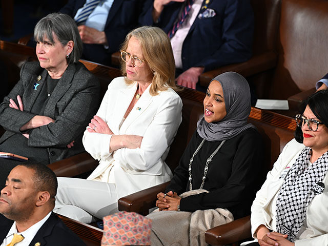 Representative Ilhan Omar, a Democrat from Minnesota, second right, yells during a State o