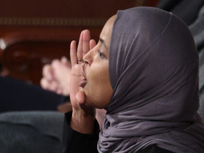 Rep. Ilhan Omar (D-MN) shouts during U.S. President Donald Trump's State of the Union
