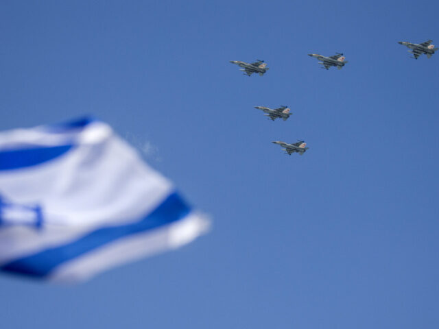 Israeli Jets Flyover Israeli F-16 fighter jets perform during an air show over the beach in the coastal city of