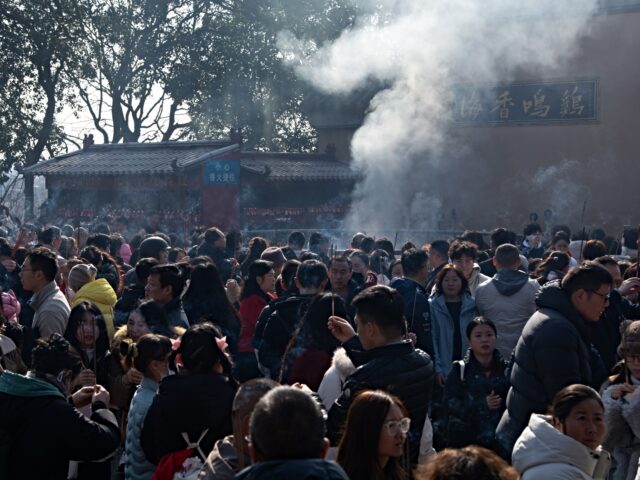 Thousands of people arrive at Jiming Temple during the first day of the Chinese Lunar New