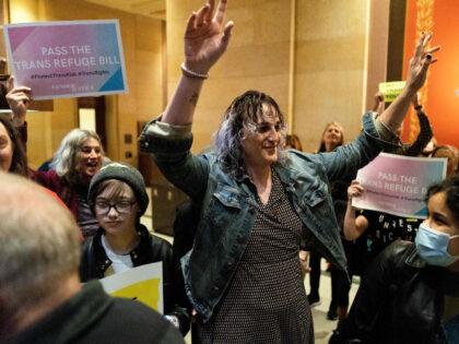 Minnesota State Representative Leigh Finke (C) arrives to cheers from supporters before th