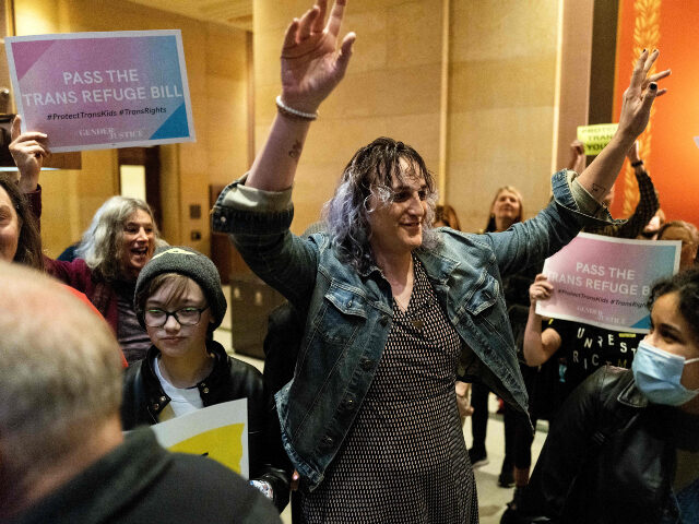 Minnesota State Representative Leigh Finke (C) arrives to cheers from supporters before th