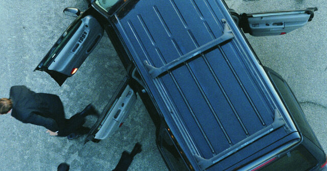 WATCH: Alert Driver Thwarts Highway Robbery by Plowing Bandit Over Guardrail