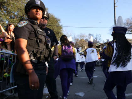 A New Orleans Police officer patrols during the Krewe of Endymion Parade during the Krewe