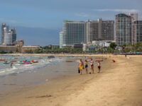 PATTAYA, THAILAND - AUGUST 22: People walk along Pattaya Beach, one of the filming locatio