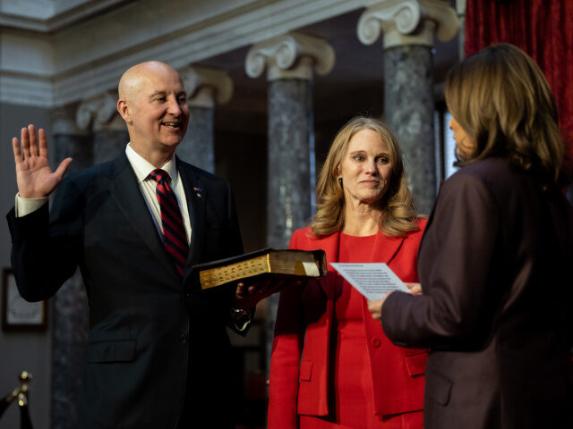 Pete Ricketts and Wife Sen. Pete Ricketts (R-NE) (L) is ceremonially sworn-in by Vice President Kamala Harris as
