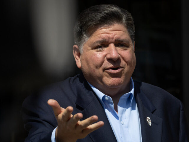 Illinois Governor JB Pritzker speaks to the press following a visit to the National Museum