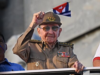 Cuba's former President Raul Castro waves a Cuban national flag during the commemoration o