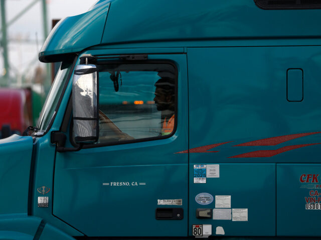 A truck drives through the Port of Oakland on November 14, 2025 in Oakland, California. Ca