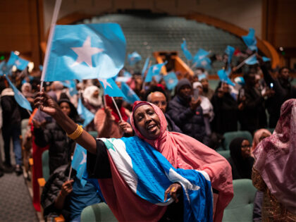 MINNEAPOLIS, MN. - DECEMBER 2022: Sawo Kwao sang and waved the Somali flag Thursday night,