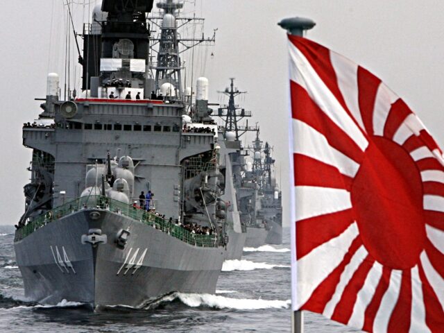 TOPSHOT - The flag of the Japanese Maritime Self-Defense Force (MSDF) flutters in the wind