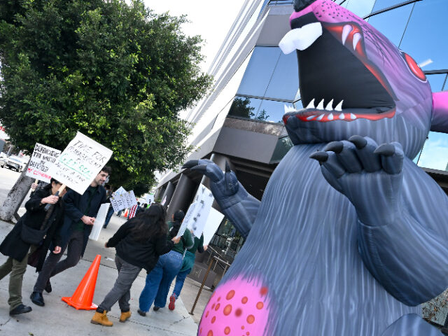 Protestors at a strike by the Writers Guild of America (WGA) staff ahead of Alliance of Mo