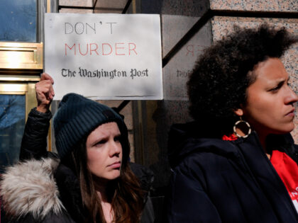 A demonstrator holds a "Don't Murder The Washington Post" sign alongside me