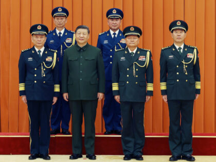 Xi Jinping, chairman of the Central Military Commission CMC, and other leaders pose for a