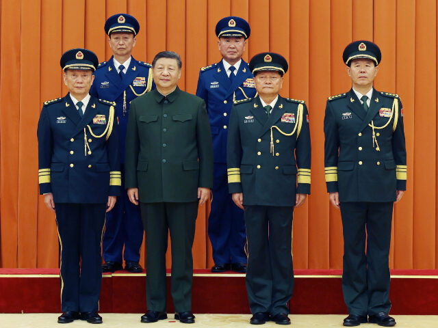 Xi Jinping, chairman of the Central Military Commission CMC, and other leaders pose for a