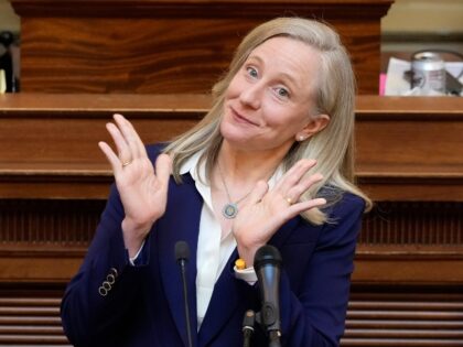 Virginia Gov. Abigail Spanberger waves to her husband as she prepares to deliver her State
