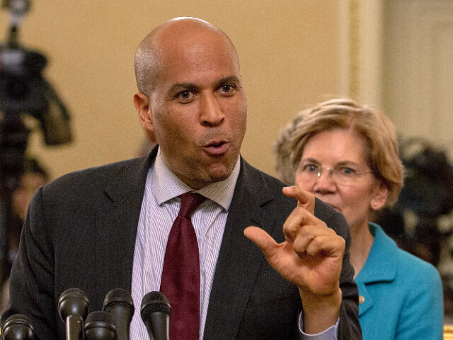 corybookerlizwarren WASHINGTON, DC - JULY 24: Sen. Cory Booker (D-NJ) and Sen. Elizabeth Warren (D-MA) attend