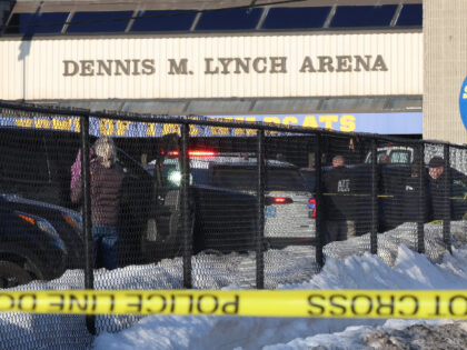Police and ATF agents stand near the Lynch Arena in Pawtucket, R.I., after a shooting at t