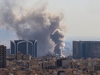 Plumes of smoke rise following reported explosions in Tehran on March 1, 2026. Ayatollah A