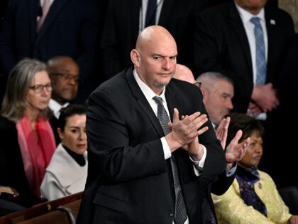 Senator John Fetterman, a Democrat from Pennsylvania, applauds during a State of the Union