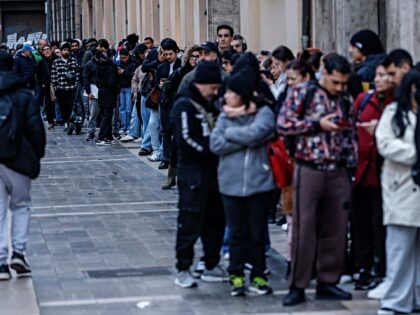 VALENCIA VALENCIAN COMMUNITY, SPAIN - FEBRUARY 05: Dozens of immigrants queue at Valencia