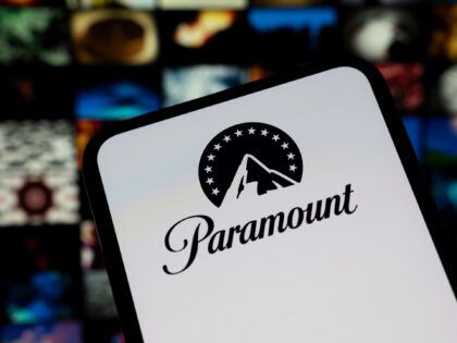 n this photo illustration, the Paramount logo appears on a cell phone with a streaming sit