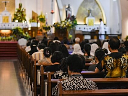 Hundreds of worshipers participate in Tirakatan and Rosary prayers on the death of Pope Fr