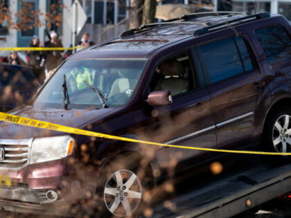 MINNEAPOLIS, MINNESOTA - JANUARY 07: A vehicle is towed away after a shooting by an ICE ag