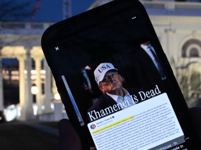 trump Khamenei This illustration shows a person holding a smartphone displaying a Truth Social post by US