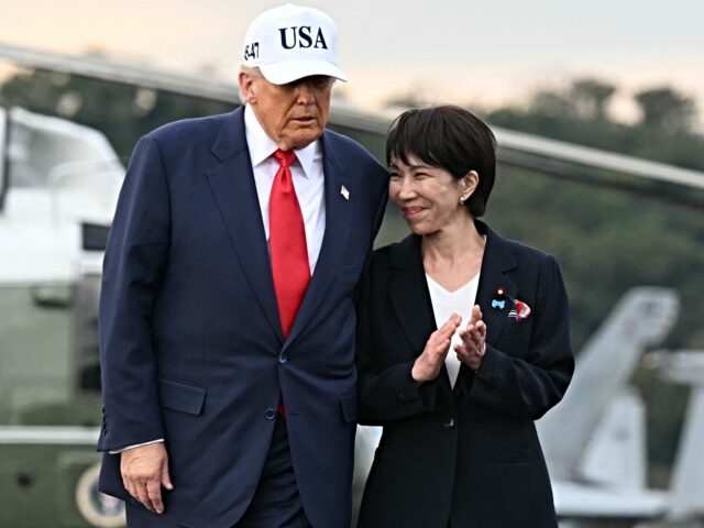 trump and Takaichi US President Donald Trump (L) and Japan's Prime Minister Sanae Takaichi arrive on board th