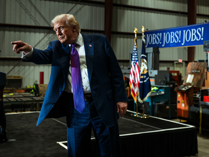 President Donald Trump poses with guests before departing Coose Steel Corporation in Rome,