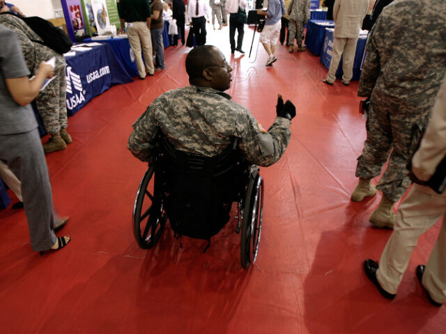US Army National Guard Sgt. Eddie Moorer of Muskegon, Michigan, gives a thumbs up while ta