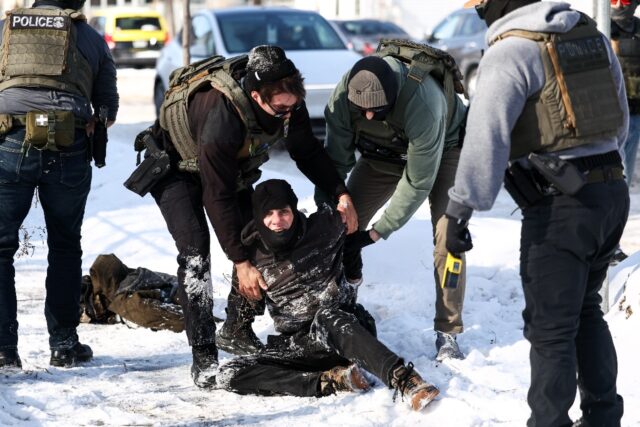 Federal agents detain a protester in Minneapolis, Minnesota on February 3, 2026